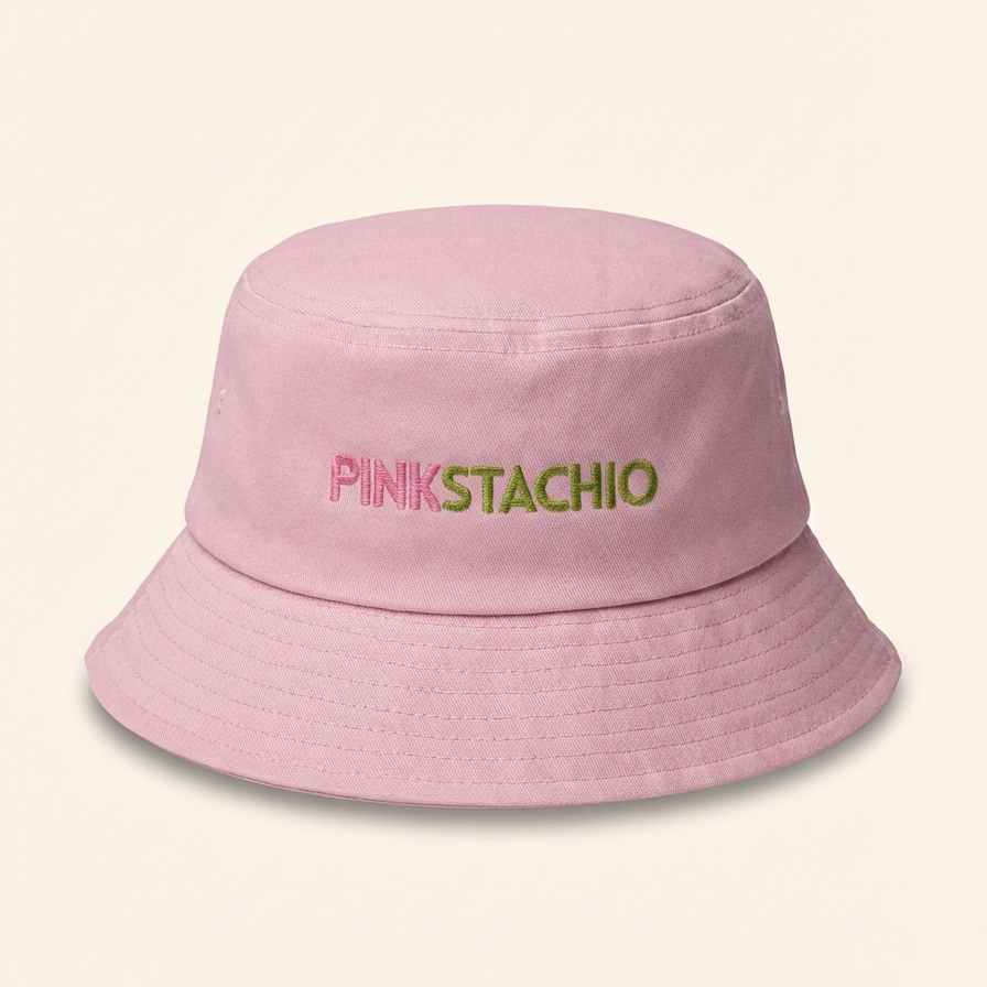 Pink bucket hat with 'PINKSTACHIO' text on a light pink background