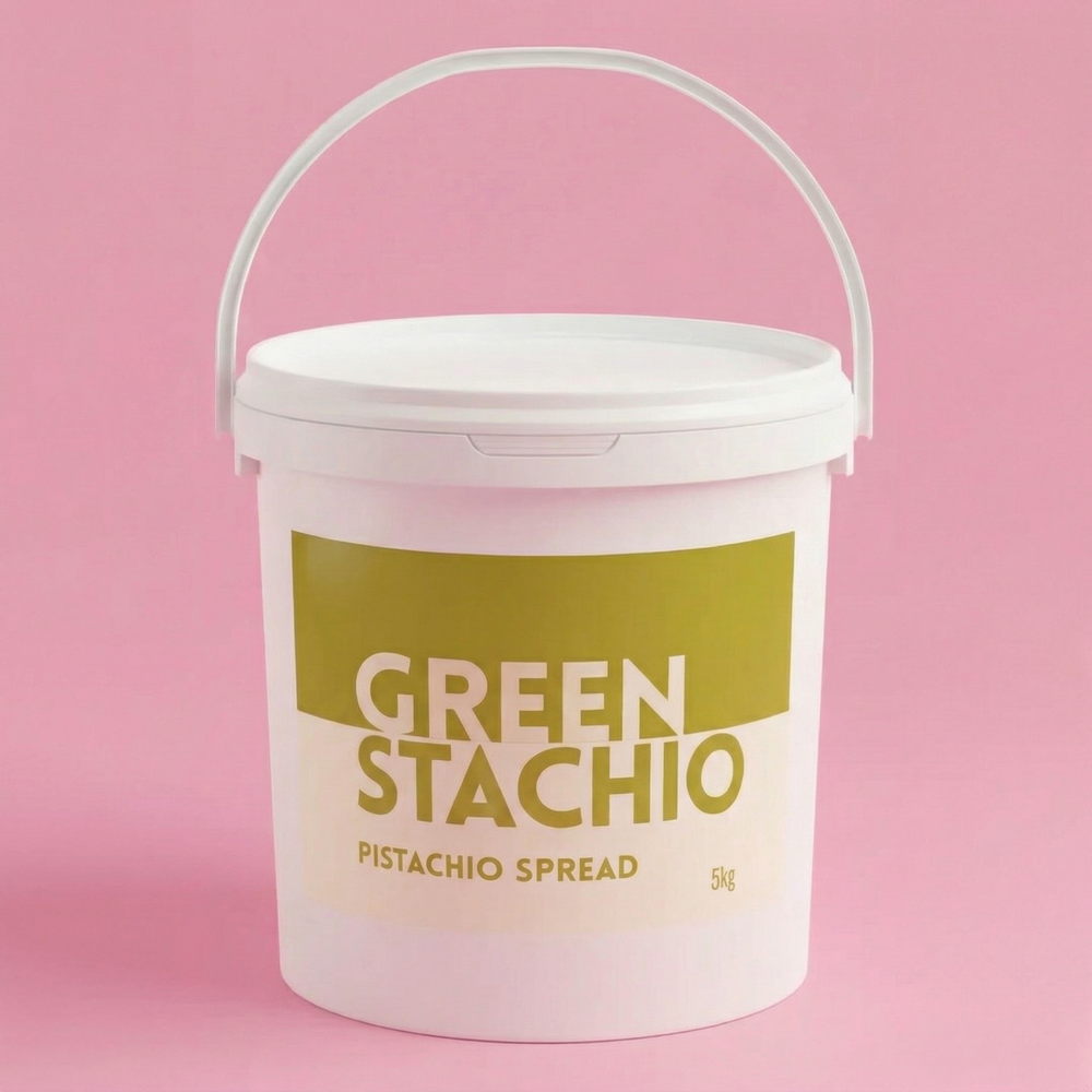 White bucket of 'Green Stachio' pistachio spread on a pink background