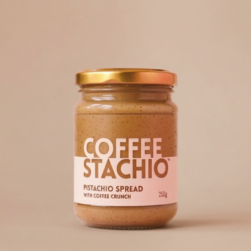 Jar of Coffee Stachio pistachio spread on a pink background